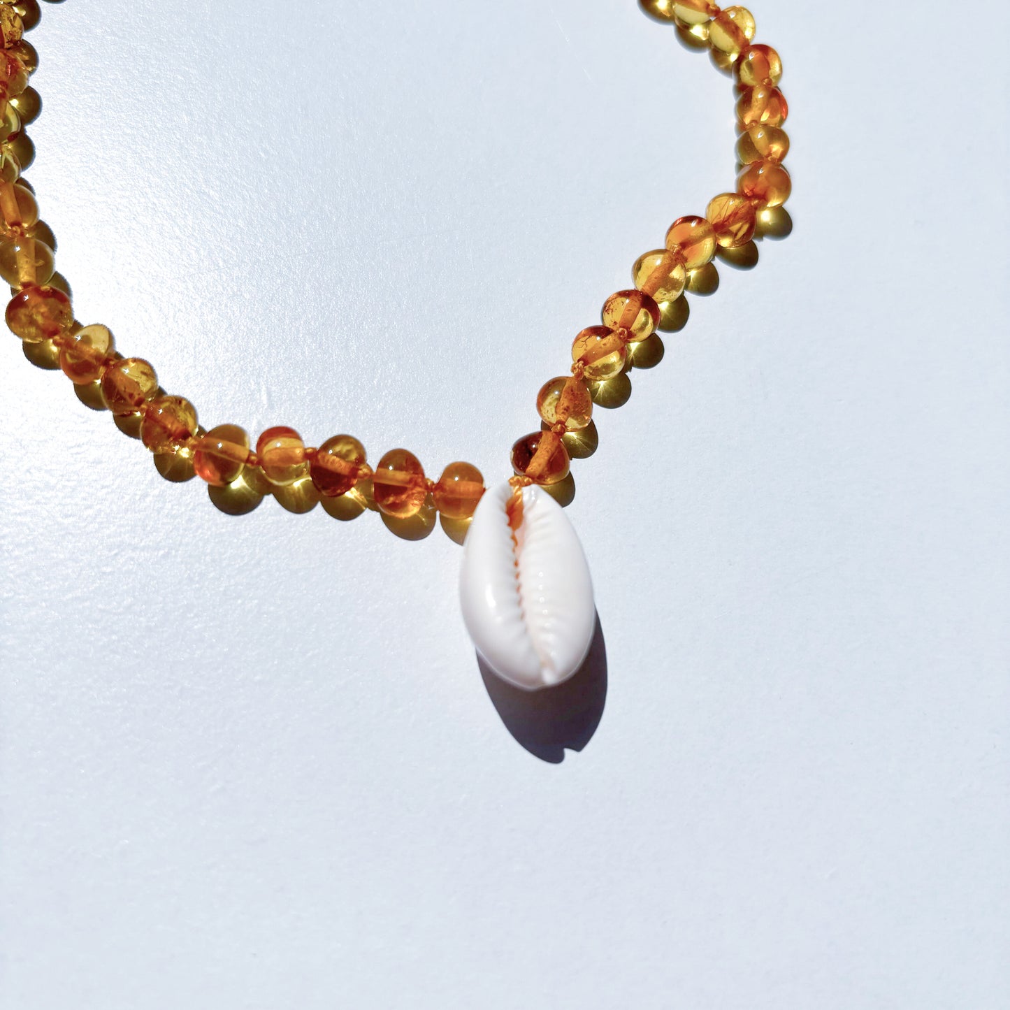 Amber Necklace with Cowrie Shell - Honey- 32cm